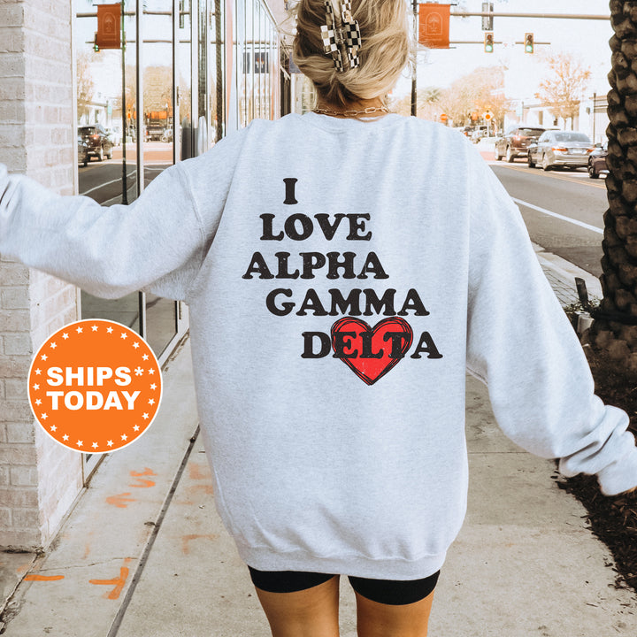a woman walking down a sidewalk wearing a sweatshirt