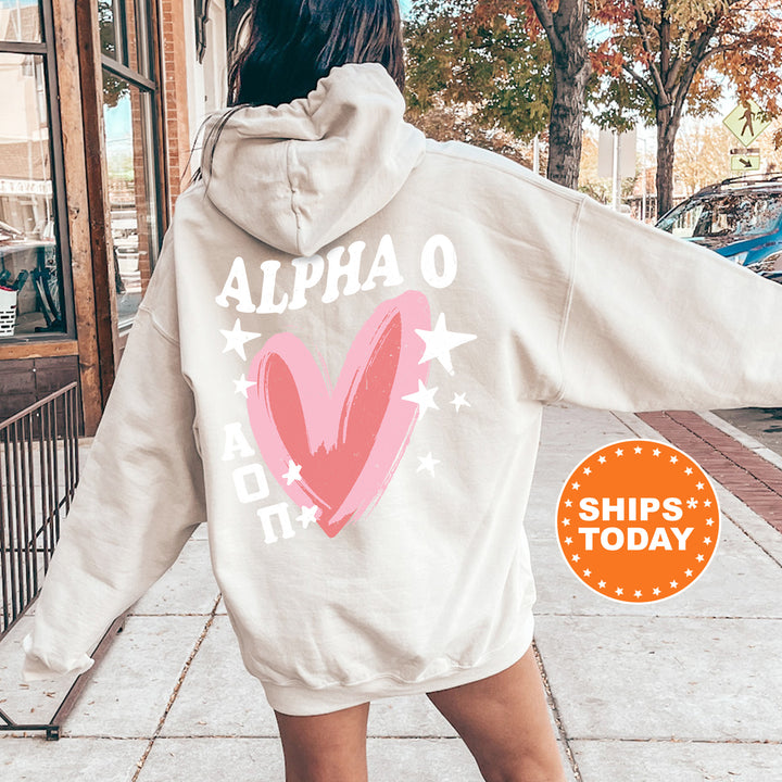 a woman in a white hoodie with a pink heart on it