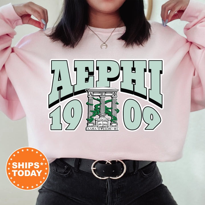 a woman wearing a pink sweatshirt with the words aeph on it