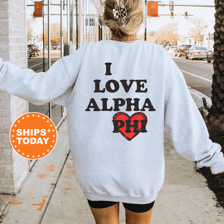 a woman walking down a sidewalk wearing a sweatshirt