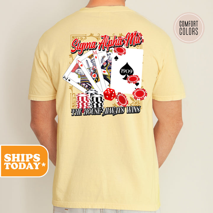 a man wearing a t - shirt with a picture of playing cards