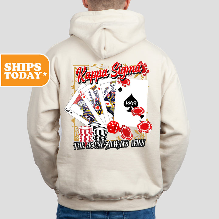 a man wearing a white hoodie with a picture of a playing card on it
