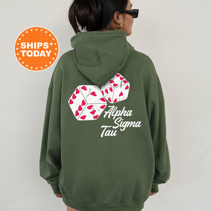 a woman wearing a green hoodie with a pair of playing cards printed on it