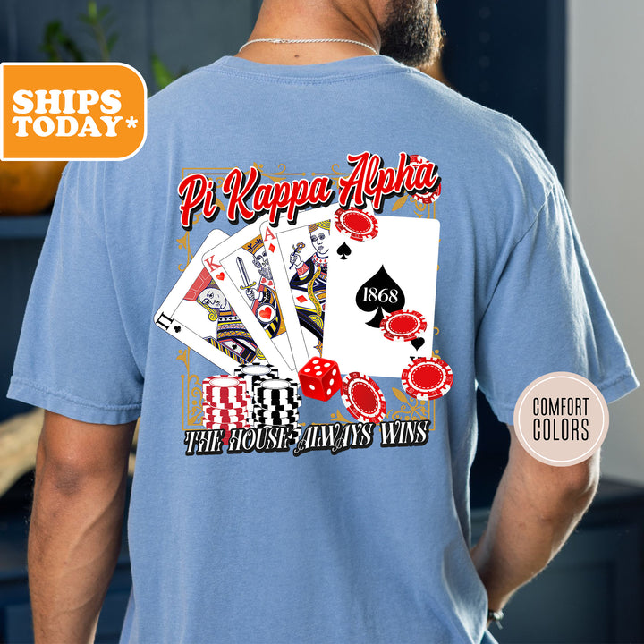 a man wearing a t - shirt with a picture of playing cards
