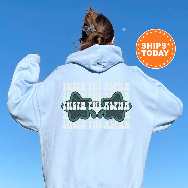 a woman wearing a white hoodie with a back print