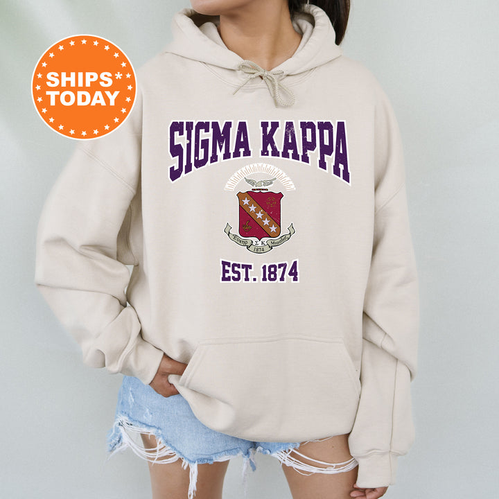 a woman wearing a sweatshirt with the words stigma kappa on it