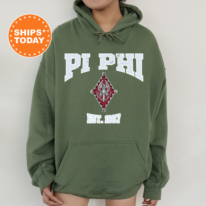 a person wearing a green hoodie with the words pi phi on it