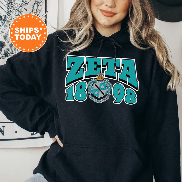 a woman wearing a black zeffa hoodie