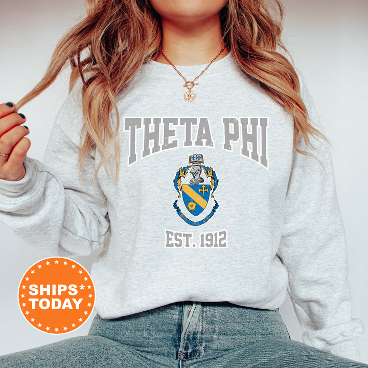 a woman wearing a sweatshirt with a phi phi crest on it