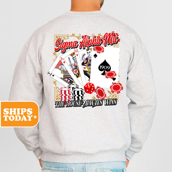 a man wearing a sweatshirt with a picture of playing cards on it
