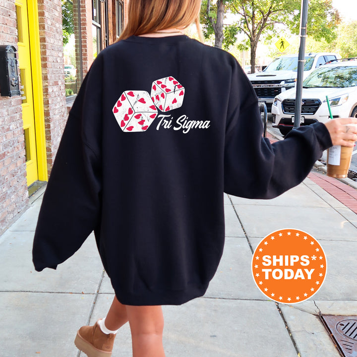 a woman walking down a sidewalk wearing a black sweatshirt