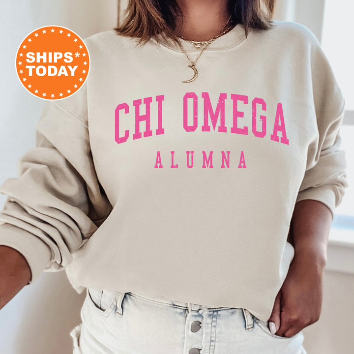 a woman wearing a sweatshirt that says chi omega