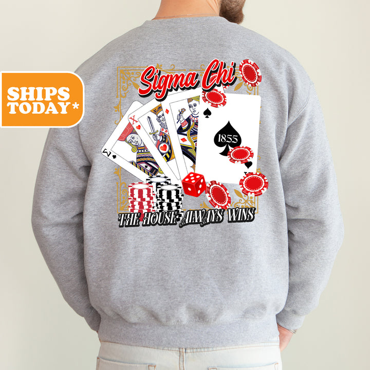 a man wearing a sweatshirt with a back print of playing cards