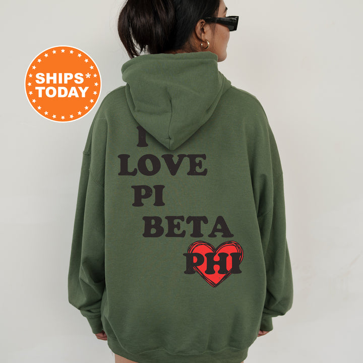 a woman wearing a green hoodie that says i love pi beta