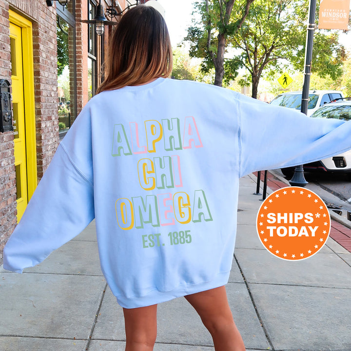 a woman walking down a sidewalk wearing a blue sweatshirt