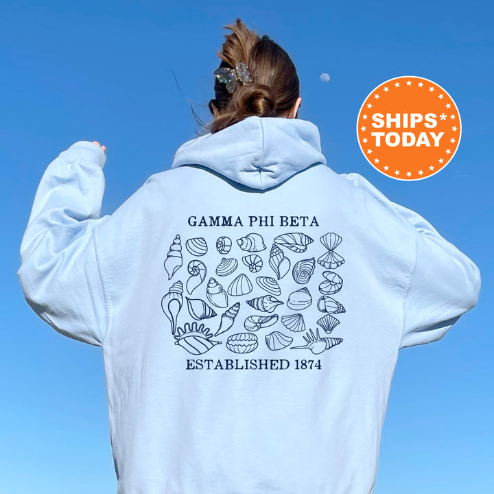 a woman wearing a white hoodie with a picture of the back of her sweatshirt