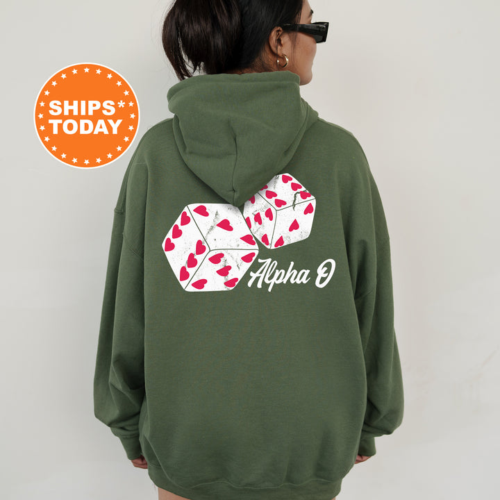 a woman wearing a green hoodie with a pair of dice on it