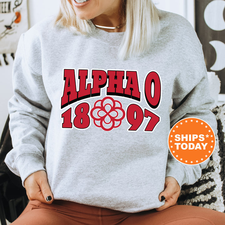 a woman sitting on a chair wearing a sweatshirt