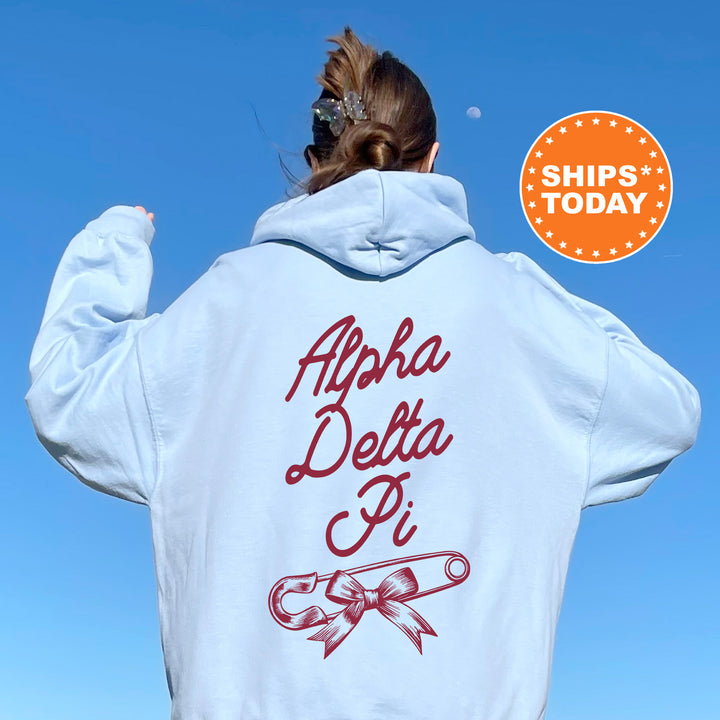 a woman with her back to the camera wearing a white hoodie