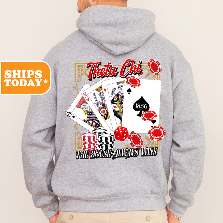 a man wearing a hoodie with playing cards on it