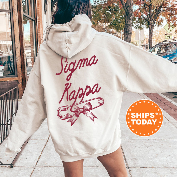 a woman in a white hoodie is walking down the street