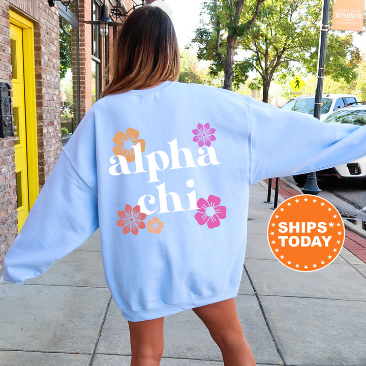 a woman walking down a sidewalk wearing a blue sweatshirt