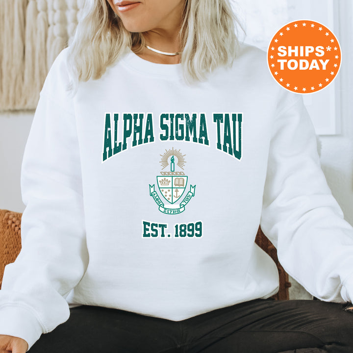 a woman sitting on a chair wearing a white sweatshirt