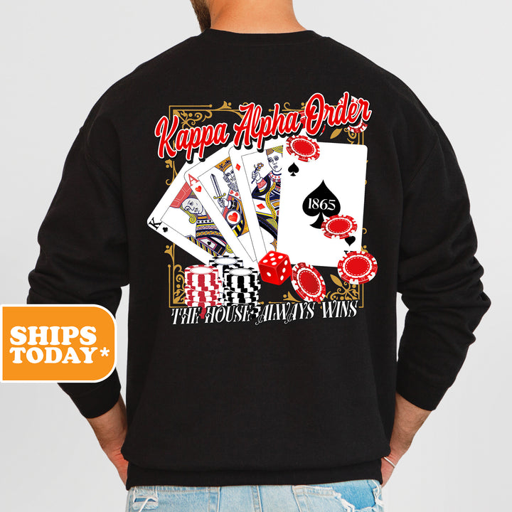 a man wearing a black sweatshirt with a picture of a playing card on it