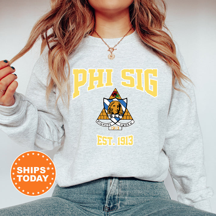 a woman wearing a phi sig sweatshirt and jeans