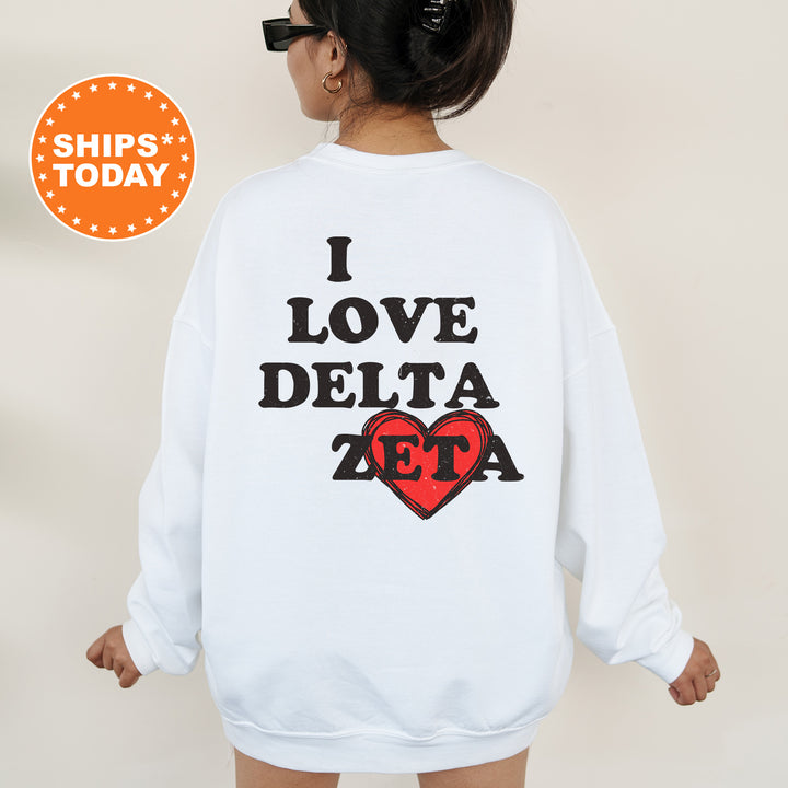 a woman wearing a sweatshirt that says i love delta
