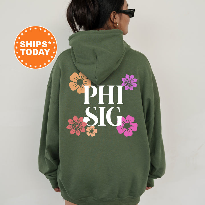 a woman wearing a green hoodie with flowers on it