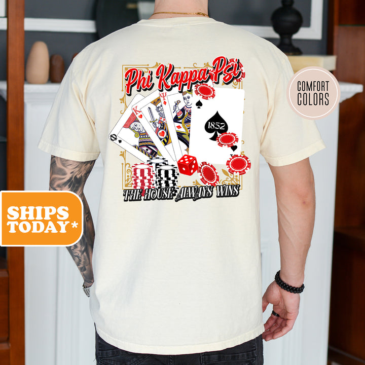 a man wearing a t - shirt with a picture of playing cards on it