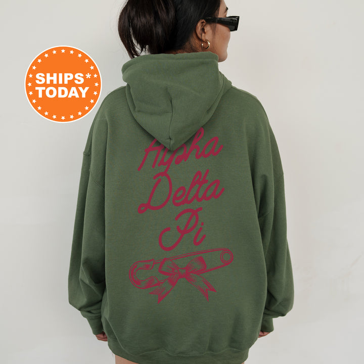 a woman wearing a green hoodie with red writing on it