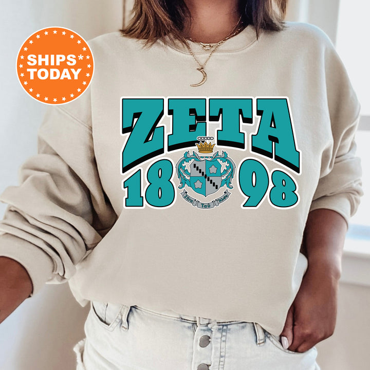 a woman wearing a sweatshirt with the words zetta on it
