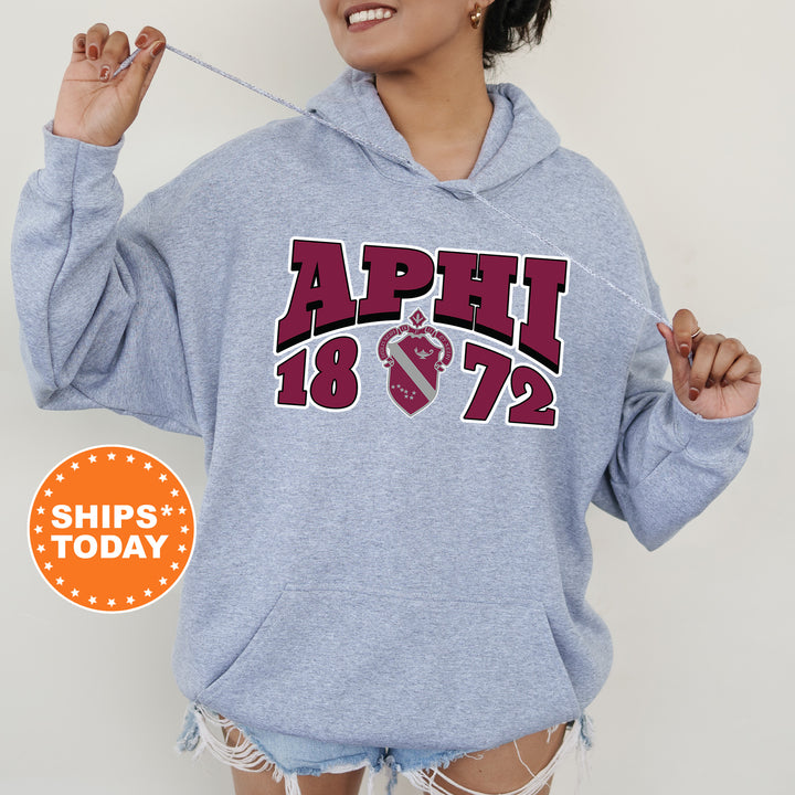 a woman wearing a blue hoodie with the words april on it
