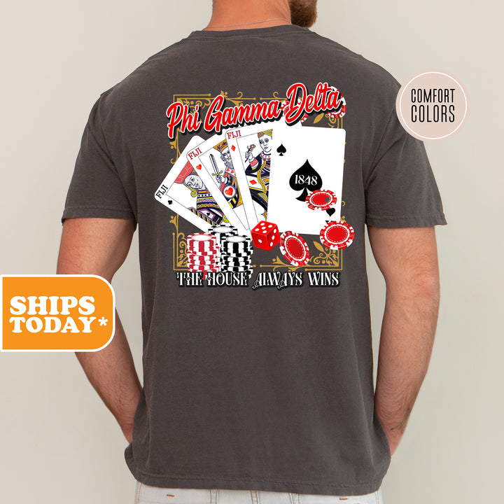 a man wearing a t - shirt with a picture of playing cards