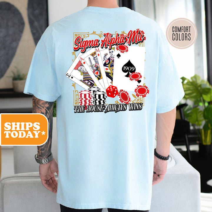 a man wearing a blue shirt with a picture of playing cards on it