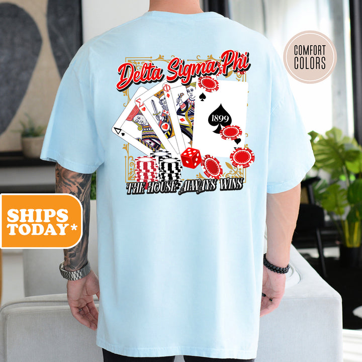 a man wearing a blue shirt with a picture of a deck of cards on it