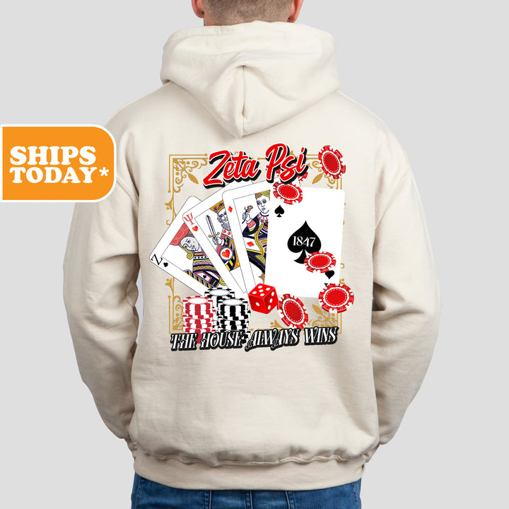 a man wearing a white hoodie with a card design on it