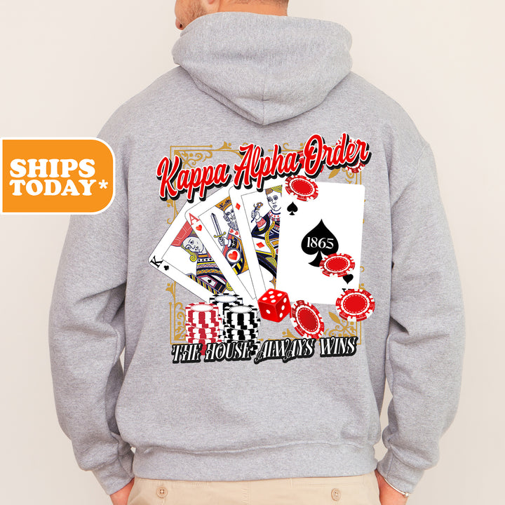 a man wearing a gray hoodie with a picture of playing cards on it