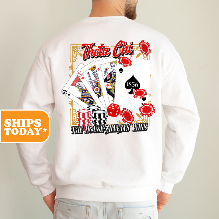 a man wearing a white shirt with a picture of a deck of cards on it