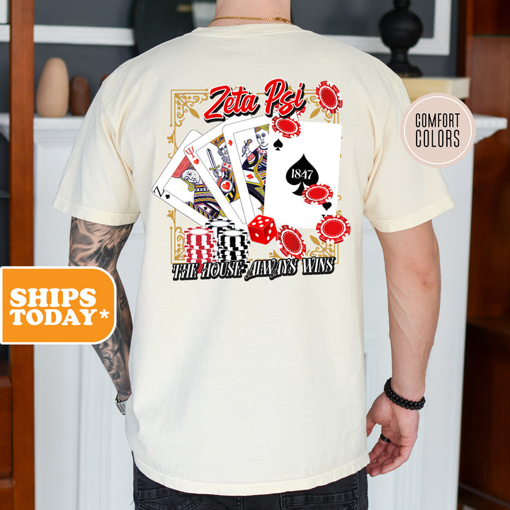 a man wearing a t - shirt with a picture of playing cards on it