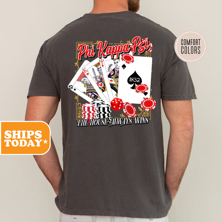 a man wearing a gray shirt with a picture of playing cards on it