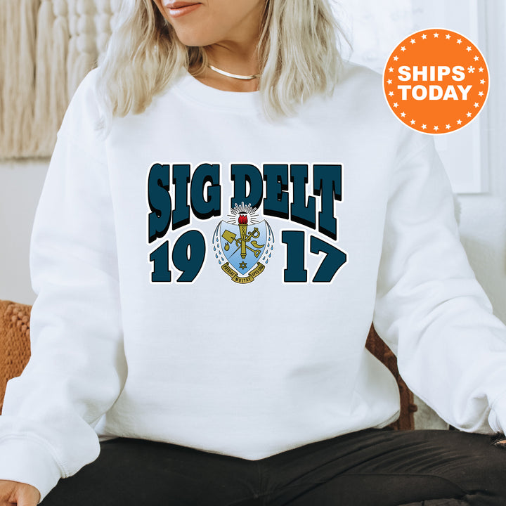 a woman sitting on a chair wearing a white sweatshirt