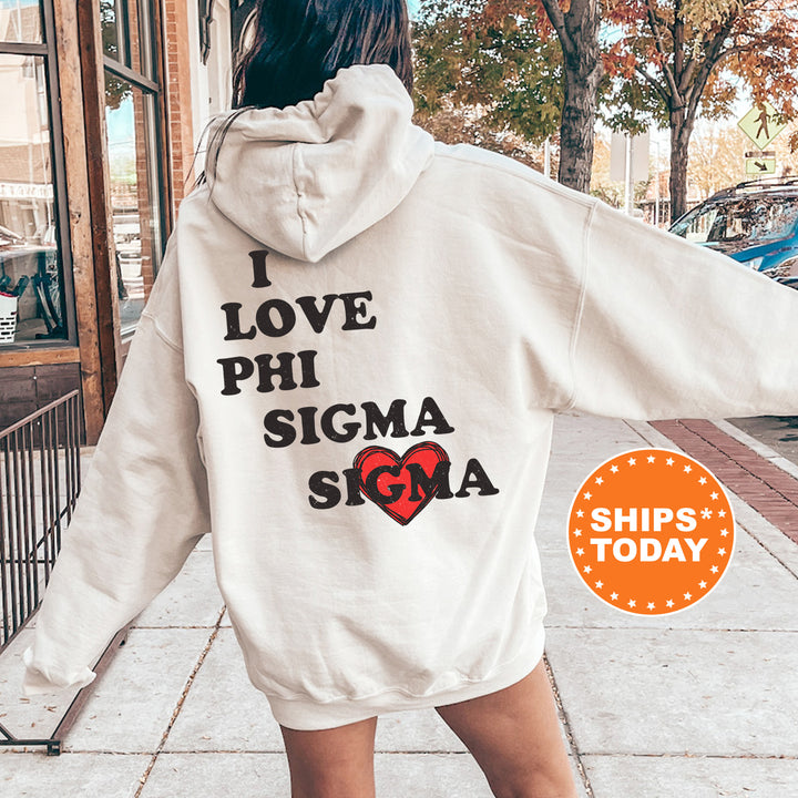 a woman walking down a sidewalk wearing a white hoodie