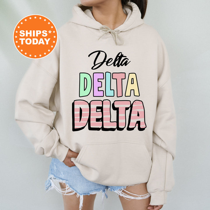a woman wearing a sweatshirt that says delta delta