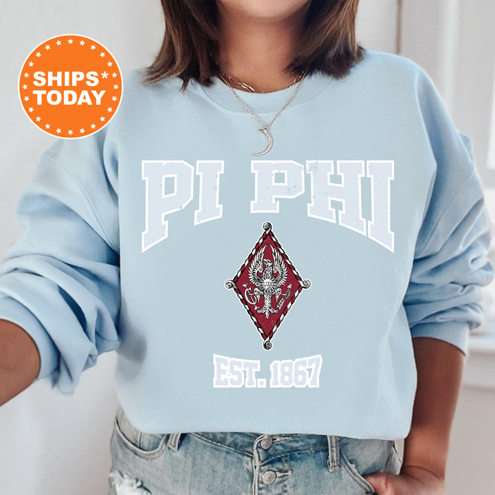 a woman wearing a blue sweatshirt with the words phi phi on it