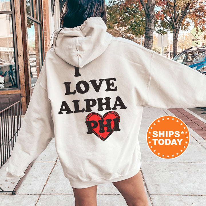 a woman walking down a sidewalk wearing a white hoodie