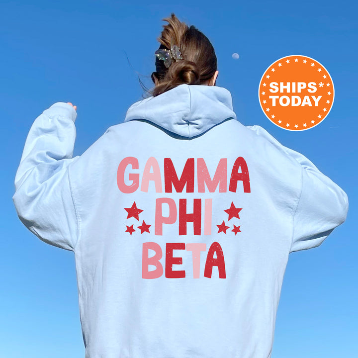 a woman wearing a white hoodie that says garma phi beta