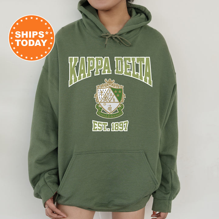 a woman wearing a green kapa delta hoodie